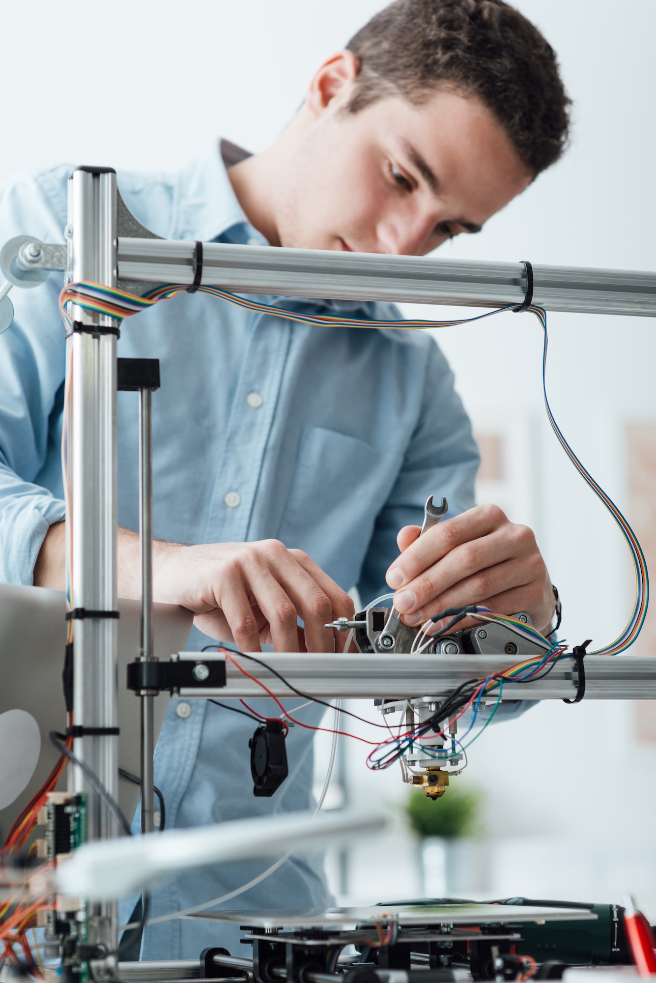 Engineer working on a 3D printer